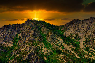 Scenic view of mountains against sky during sunset