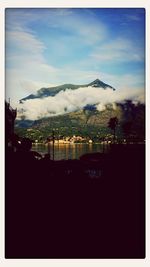 Mountain range against cloudy sky