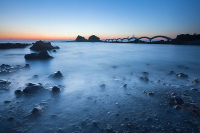 Scenic view of sea against dramatic sky