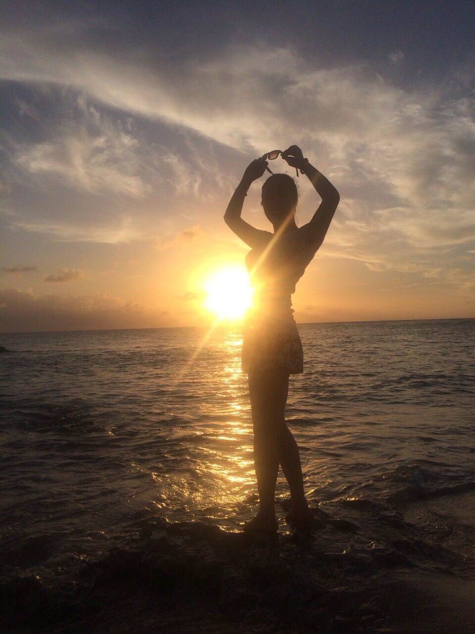 sunset, sea, sun, water, lifestyles, leisure activity, sky, horizon over water, beach, full length, silhouette, standing, orange color, sunlight, shore, beauty in nature, scenics, vacations