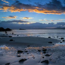 Scenic view of sea against sky at sunset