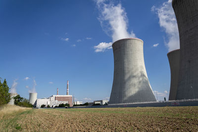 Cooling towers at nuclear power plant, energy self-sufficiency, greenhouse emission reduction