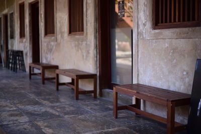 Empty chairs and table in building