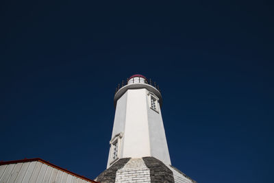 Low angle view of lighthouse against clear sky