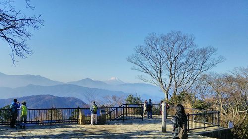 Scenic view of mountains against blue sky