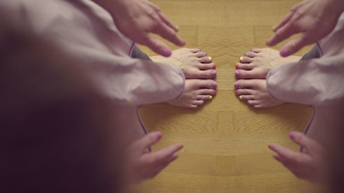 Close-up of hands on table