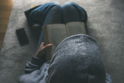 Low section of man standing on street