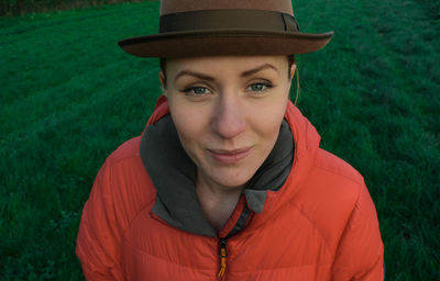 Portrait of smiling young woman on grass