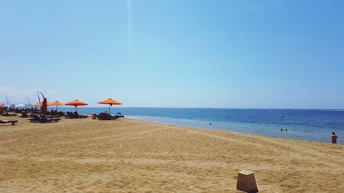 Scenic view of beach against clear sky