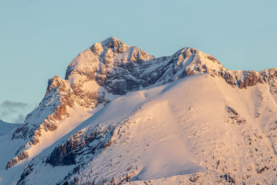 Scenic view of snowcapped mountains against clear sky