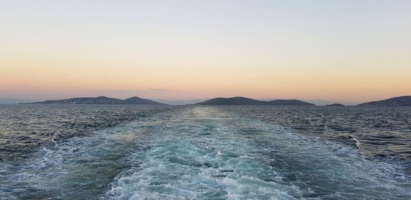 Scenic view of sea against clear sky during sunset