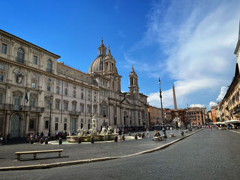 Buildings in city against sky