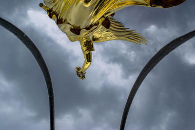 Low angle view of statue against sky