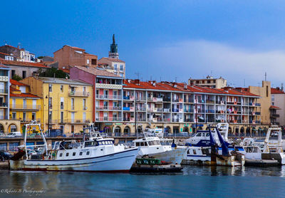 Boats moored at harbor