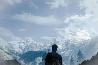 Scenic view of snow covered mountains against sky