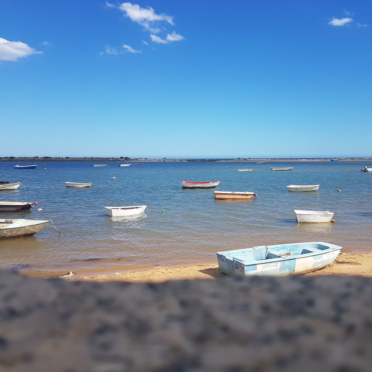 BOATS MOORED ON SEA AGAINST CLEAR SKY