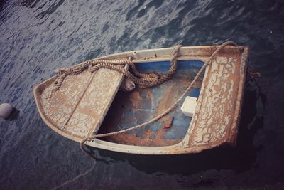 High angle view of old boat moored at beach