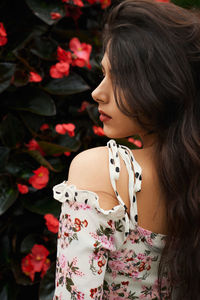 Young woman looking away outdoors