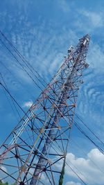 Low angle view of telephone pole against sky