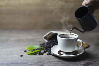 Close-up of coffee cup on table