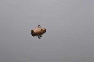 Low angle view of helicopter flying in sky
