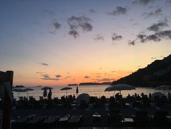 Scenic view of beach against sky during sunset