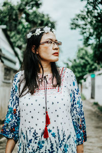 Portrait of a young woman looking away