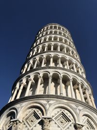 Low angle view of pisa tower against clear blue sky