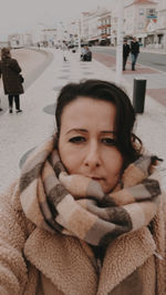 Portrait of young woman in snow