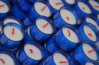 Full frame shot of blue tea lights