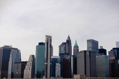 Skyscrapers in city against sky