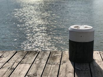 High angle view of wooden post on pier over lake