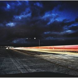 Road passing through dramatic sky