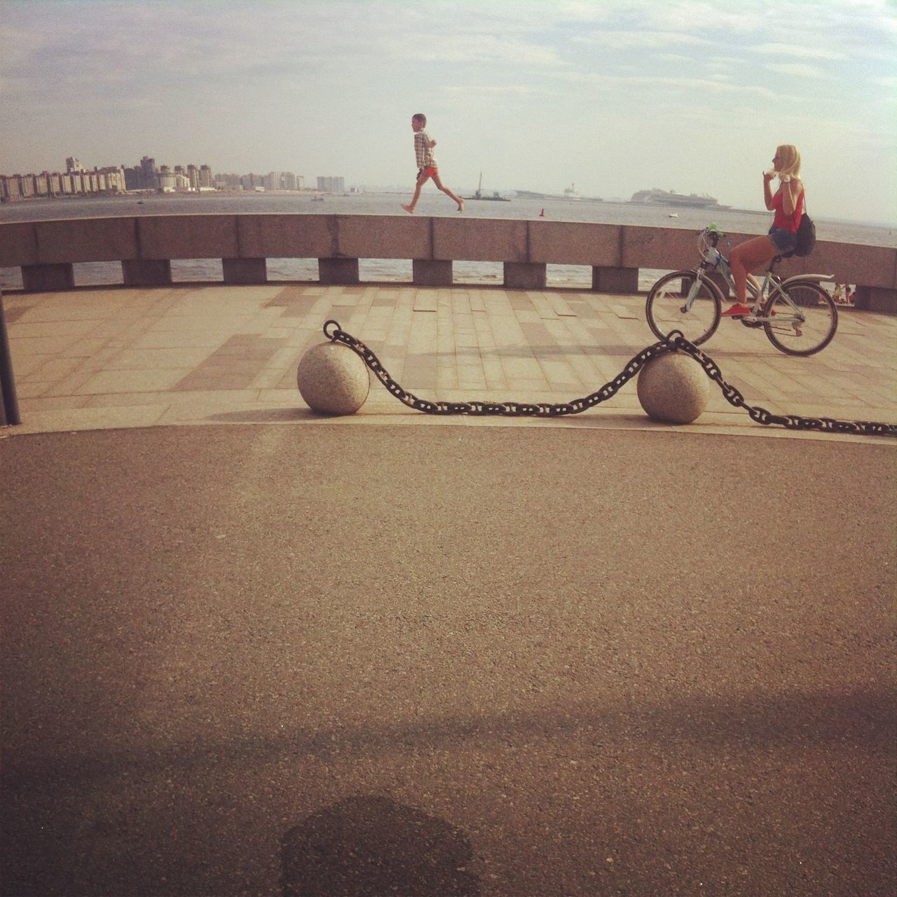 leisure activity, full length, lifestyles, bicycle, animal themes, men, sand, side view, day, outdoors, walking, transportation, one animal, mammal, shadow, domestic animals, riding, sitting