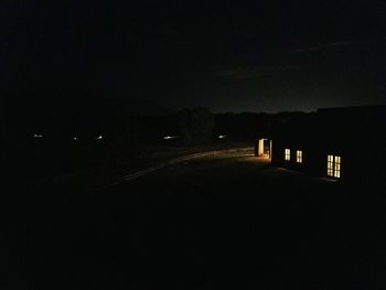 Illuminated walkway at night