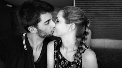 Close-up of young couple kissing