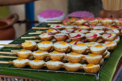 Close-up of hand holding cake