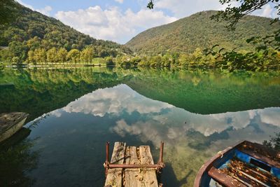 Scenic view of lake with mountains in background