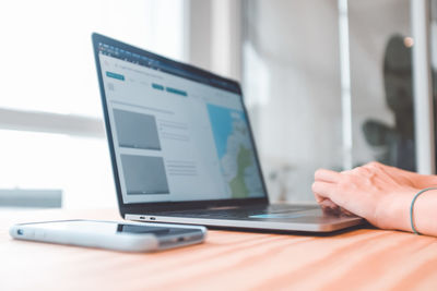 Man using laptop on table