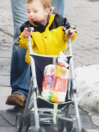 Boy playing with umbrella