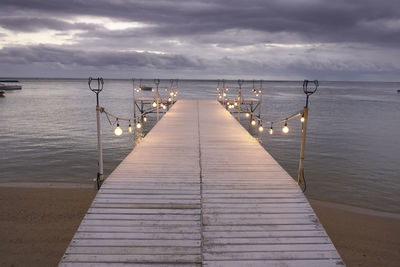 Pier over sea against sky