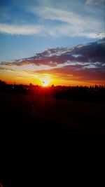 Scenic view of silhouette landscape against sky during sunset