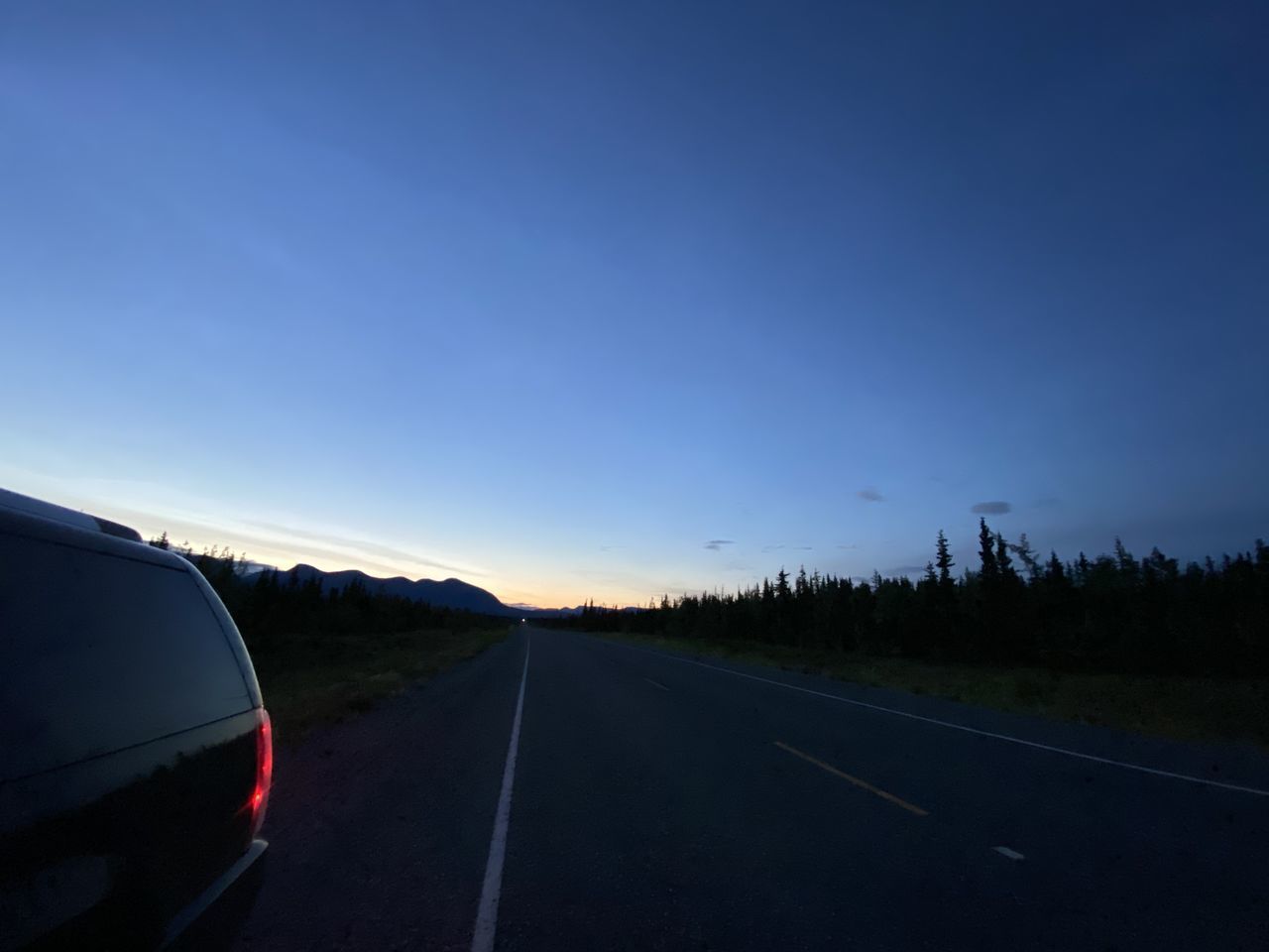 VIEW OF ROAD AGAINST SKY DURING SUNSET