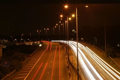 High angle view of light trails on road at night