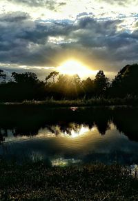 Scenic view of lake at sunset