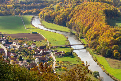 High angle view of trees by river during autumn