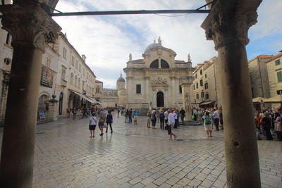 People in front of historical building