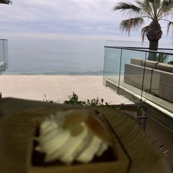 Scenic view of swimming pool by sea against sky