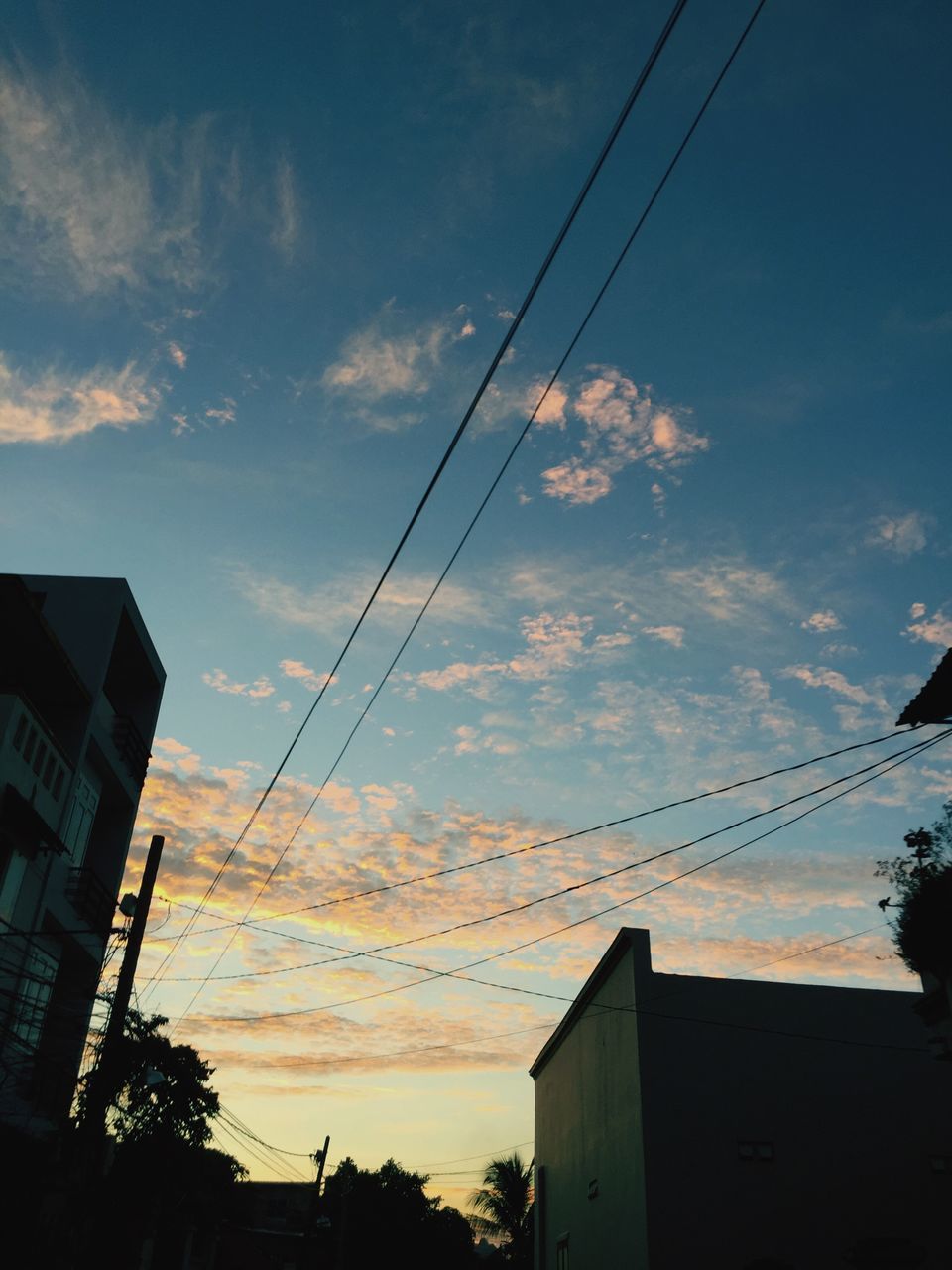 sky, sunset, cloud - sky, building exterior, power line, dusk, power supply, built structure, electricity, outdoors, cable, architecture, low angle view, no people, silhouette, scenics, electricity pylon, nature, city, beauty in nature, telephone line, day