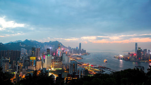 High angle view of illuminated buildings in city against sky